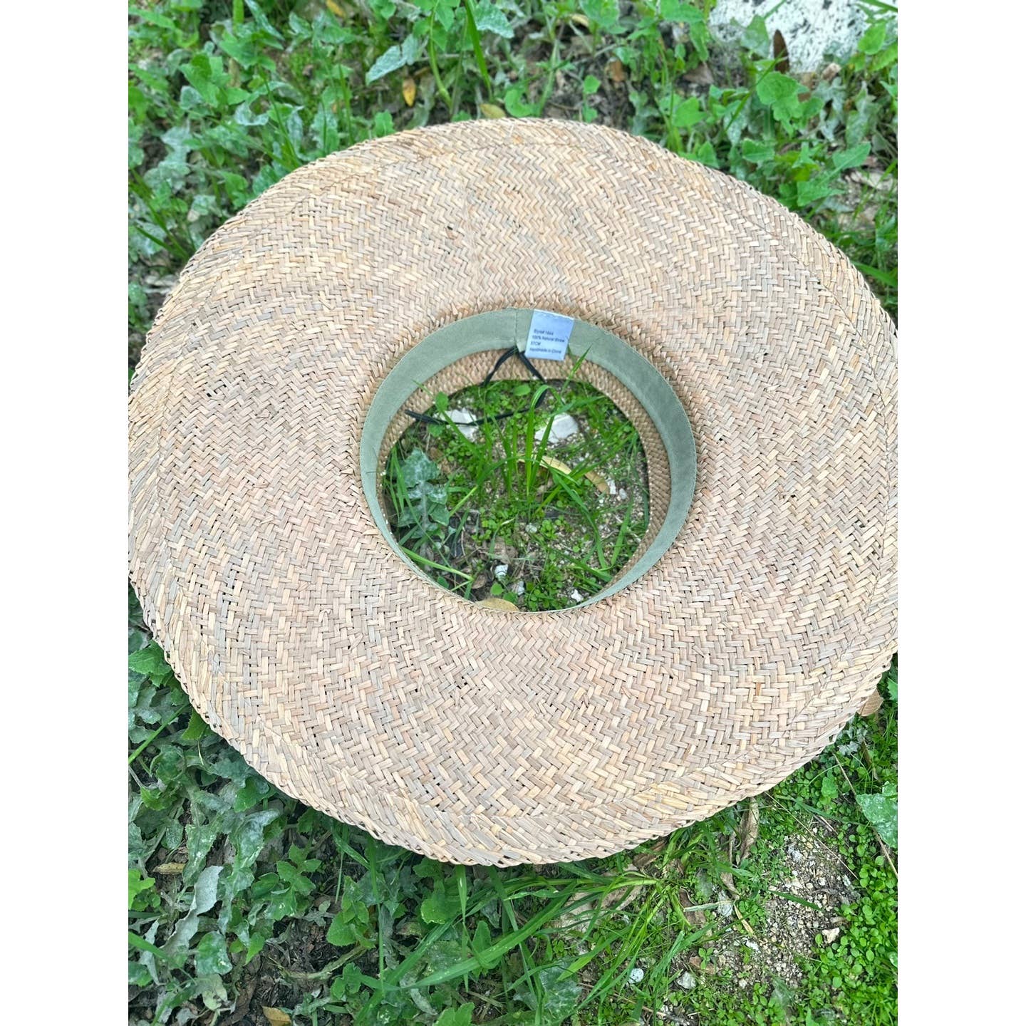 HANDWOVEN NATURAL STRAW CROWNLESS HAT for wholesale on Faire9