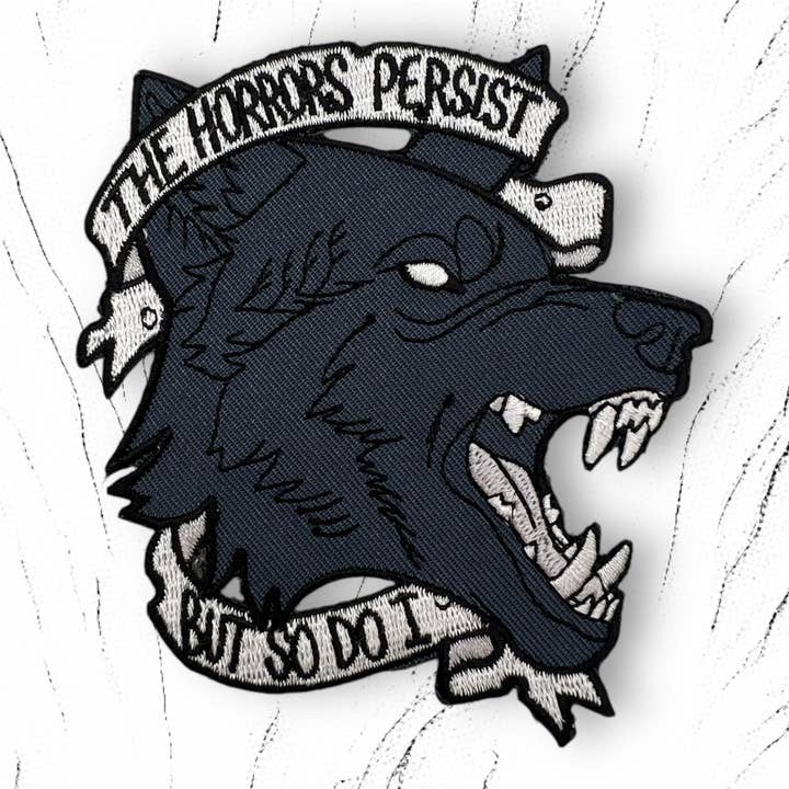 Black Wolf "The Horrors Persist" Iron-On Patch for wholesale by Triclops Rabbit