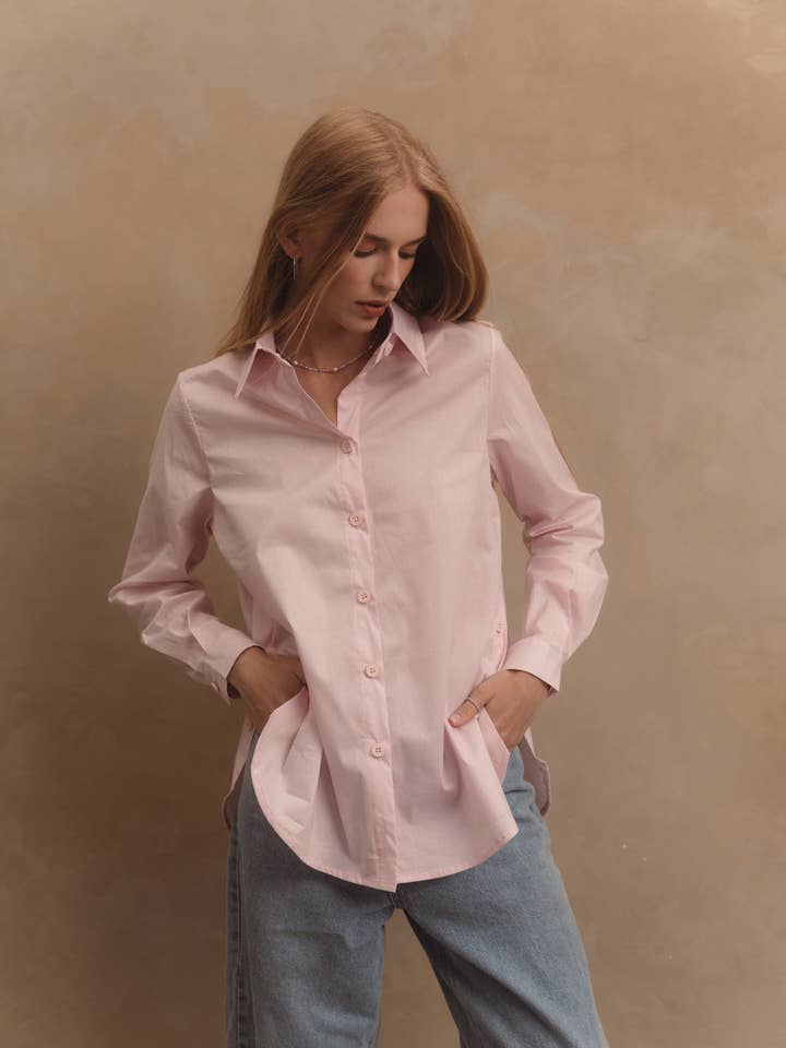 Pink cotton shirt with functional buttons on the sides for wholesale by Azuri Fashion Group