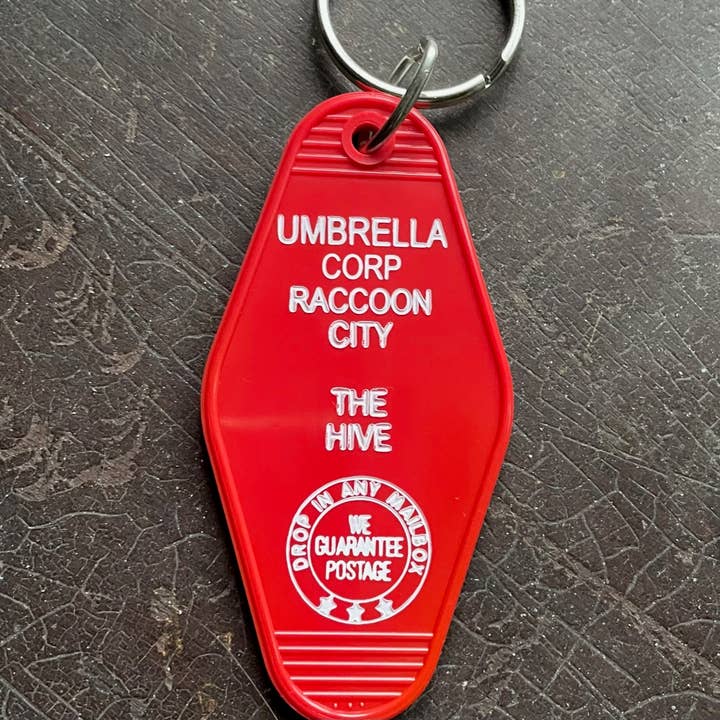 The 3 Sisters Design Co. - Wholesale Keychain - Unisex - Motel Key Fob - Umbrella Corp (Resident Evil)
