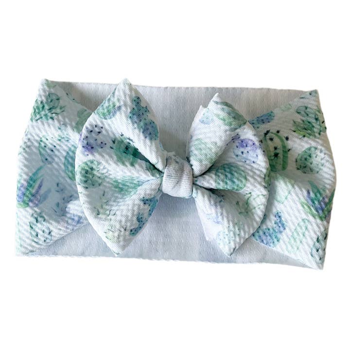 Nœud de tête en forme de cactus pastel pour la vente par Tiny toes Baby Co