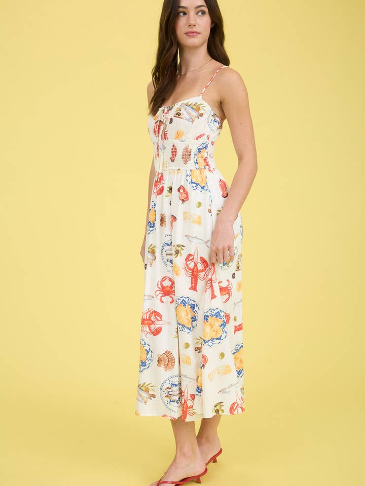 IVORY MULTI SEASIDE LUNCH PRINT SPAGHETTI STRAP MIDI DRESS for wholesale on Faire