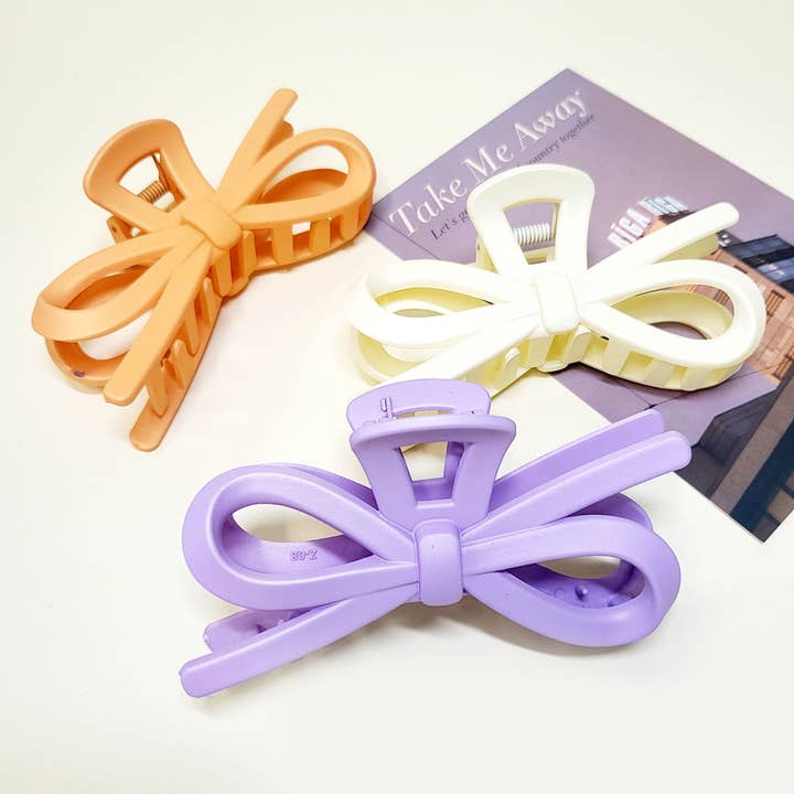 Matte Color Ribbon Shaped Hair Claw Clip for wholesale on Faire
