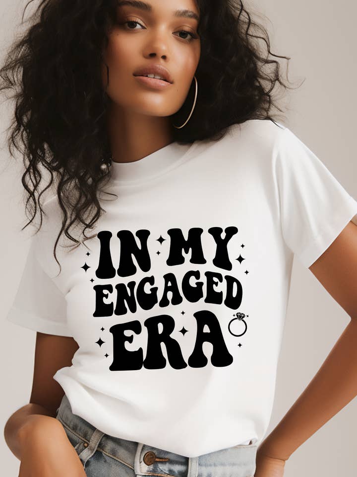In my Engaged Era Shirt for wholesale by Heirloom Bridal Company