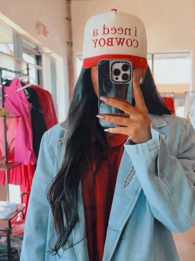 I NEED A COWBOY Trucker Hat for wholesale by KickapooEmbroidery