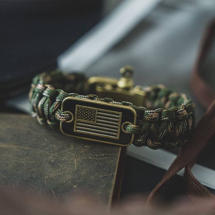 The Hero Company - Wholesale Woven/Braided Bracelet - The Hero Company-Camo Paracord Bronze Flag Bracelet- Helps Pair Veterans With A Companion Dog- Faire
