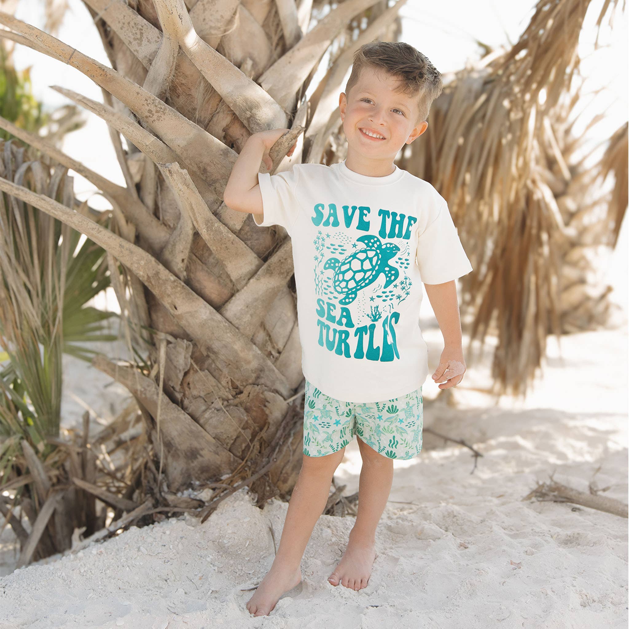 Green Save the Sea Turtles Boys Swim Trunks for wholesale on Faire3