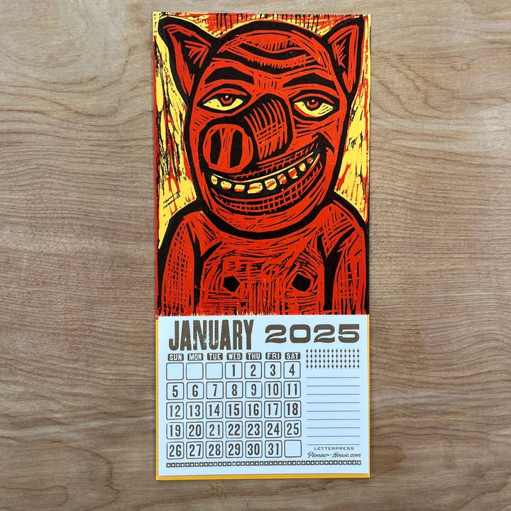 Pioneer House (formerly Yee-Haw) - Wholesale Calendar - 2025 Smiling Pig Woodcut Mini Calendar
