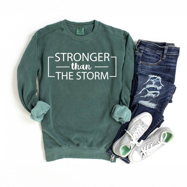 Stronger Than The Storm | Garment Dyed Sweatshirt for wholesale by Uplifting Threads Co Wholesale
