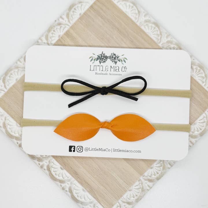 Duo di Fasce per Capelli Nero e Arancione per la vendita all'ingrosso da parte di Little Mia Co.