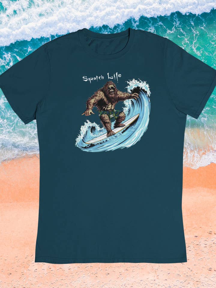 Squatch Life navy blue Surfing Bigfoot t-shirt for wholesale by Squatchin’ Country