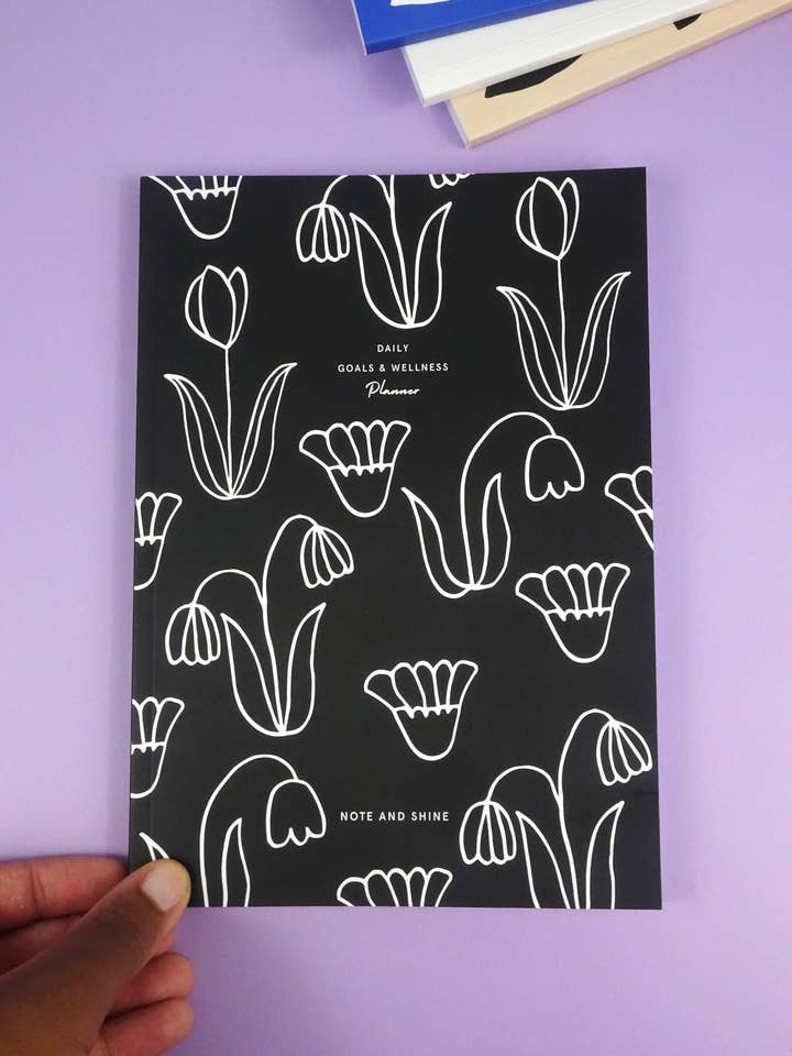 Daily Goals and Wellness Planner (Black Flowers) for wholesale by Note and Shine