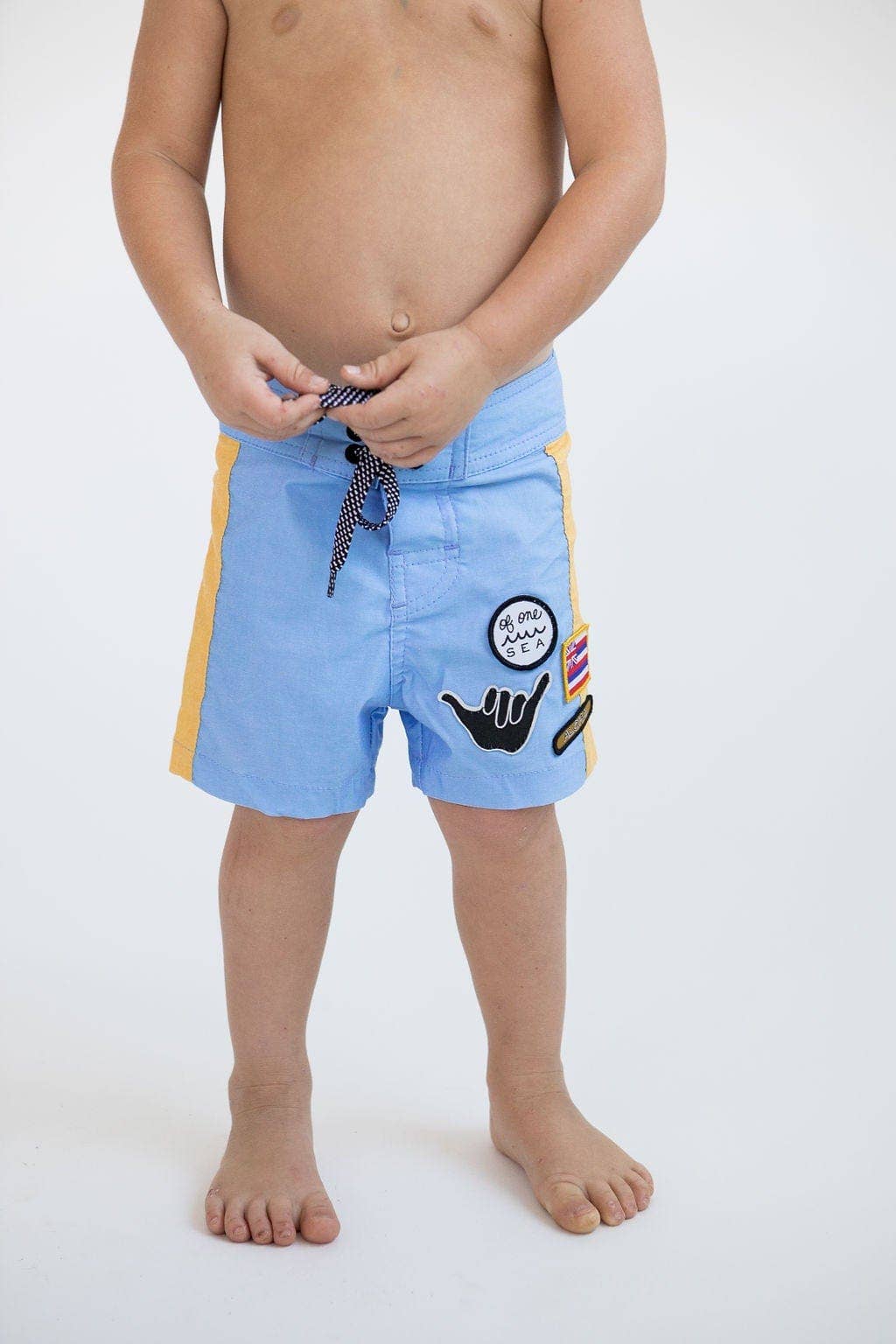 Kid’s Boardshorts in Light Blue and Yellow Colorblock Patch for wholesale on Faire7