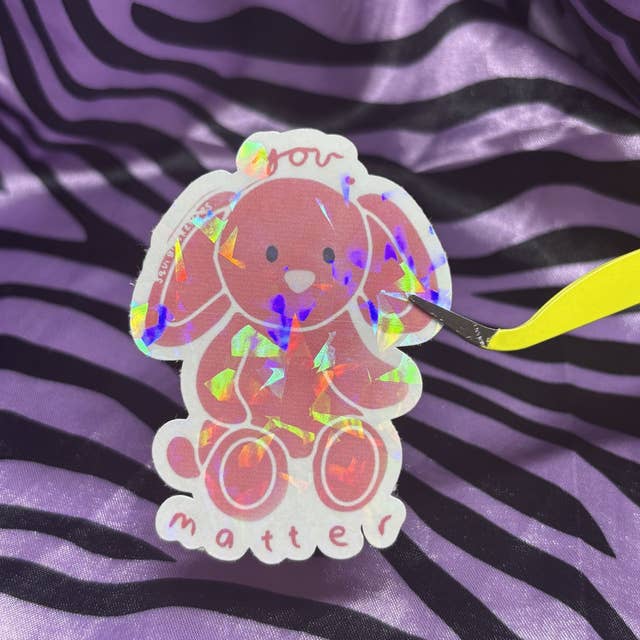 red positivity bunny sticker for wholesale by squiglysketches