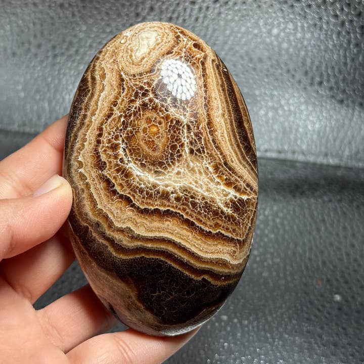 CHOCOLATE CALCITE PALM STONES 80MM-90MM for wholesale by ZeeRocks