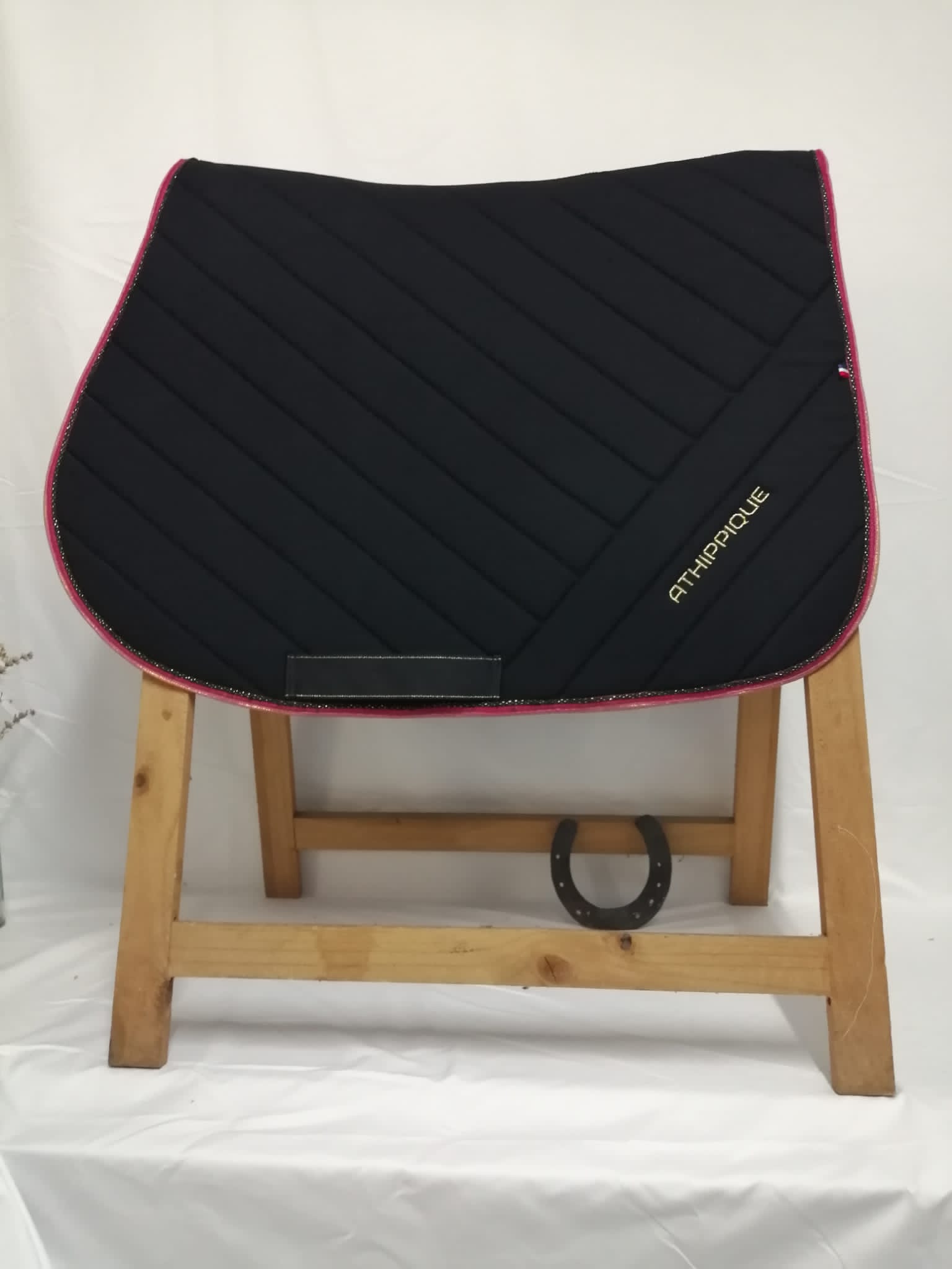 Black glitter saddle pad in fuchsia pink velvet version for wholesale on Faire1