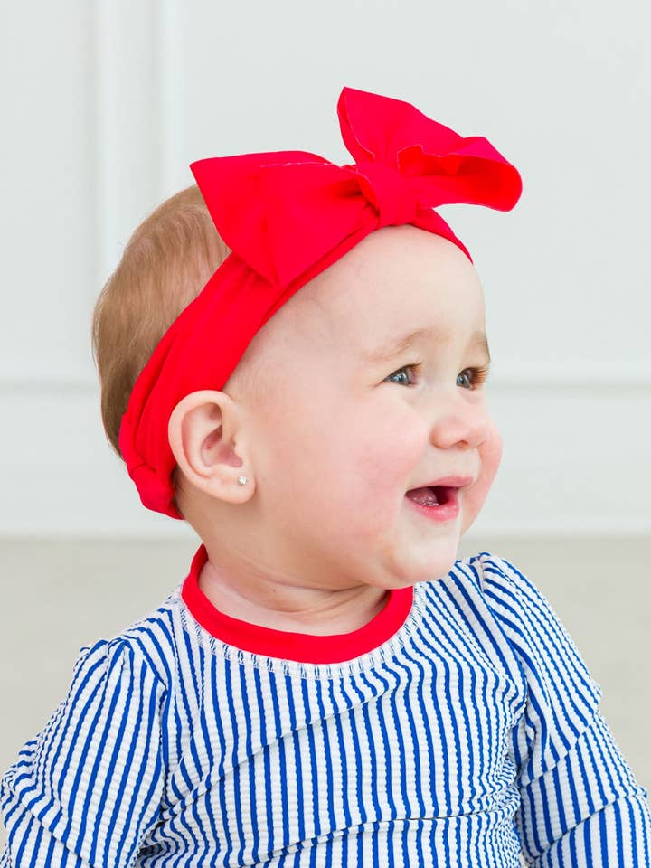 Girls Vintage Red Swim + Active Bow Headband
for wholesale by RuffleButts + RuggedButts