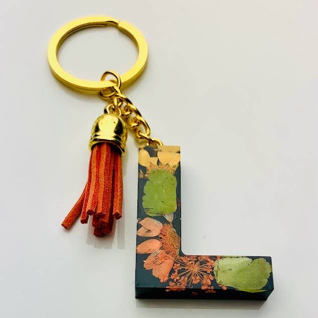 Orange Blomstret/Sort Letter Nøglering for engroshandel hos Shop Drip Express