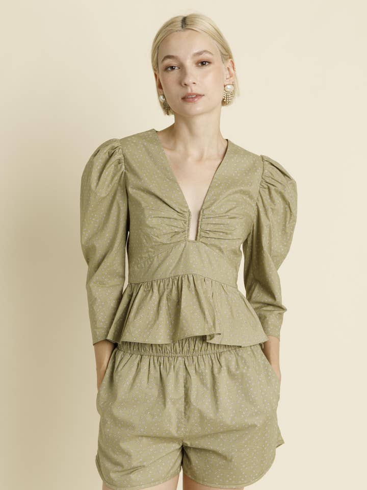 AT1922 - U-RING TRIM PEPLUM BLOUSE for wholesale by Aureum