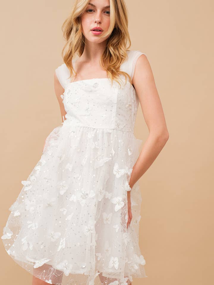 34366D - Mini-robe à sequins ornée de papillons en organza pour la vente par Blue B