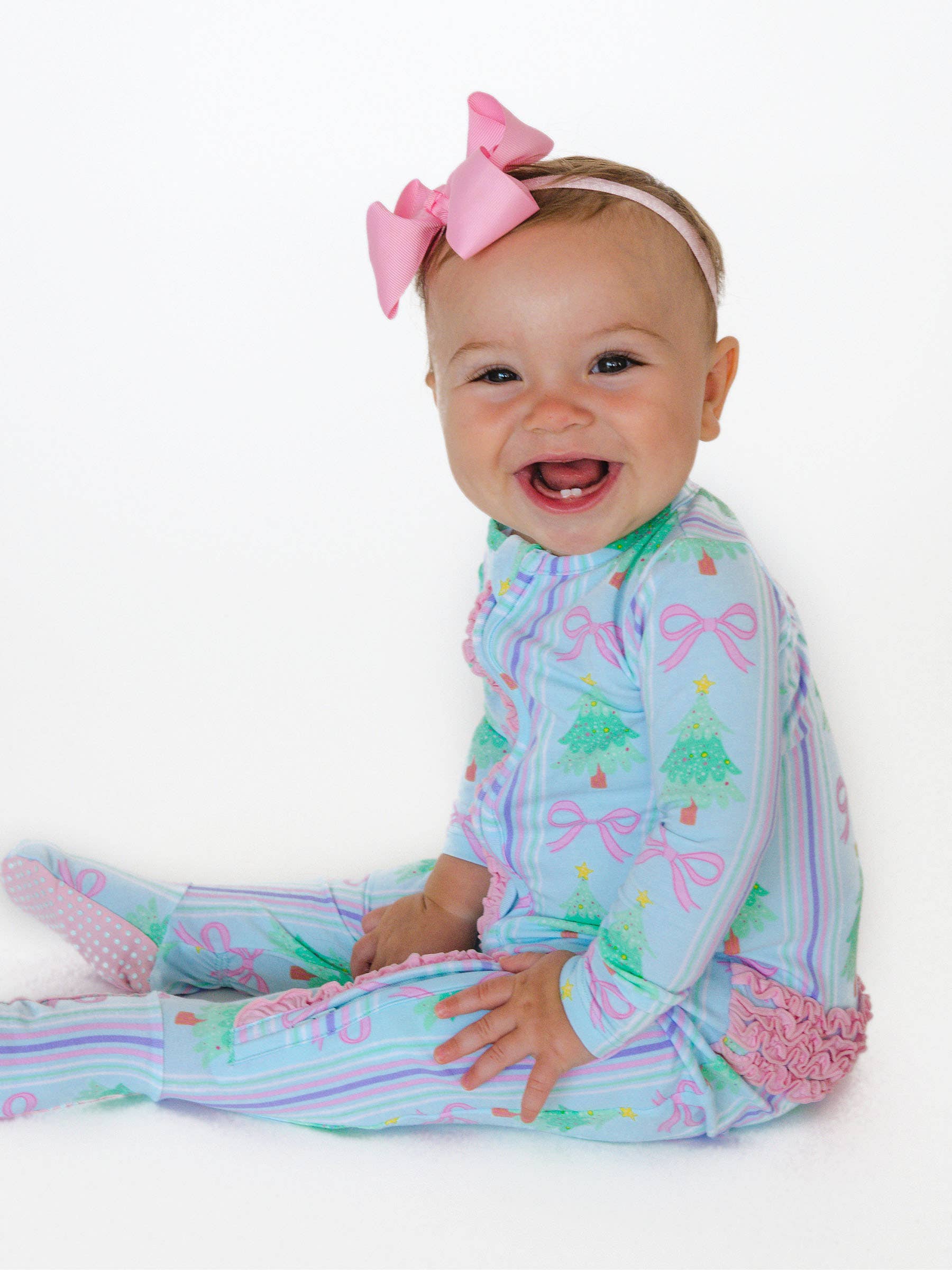 Blue SoftSnooze™ Baby Girls Cotton Modal Merry Bow Dreams Footed Ruffle One Piece Pajama for wholesale on Faire2