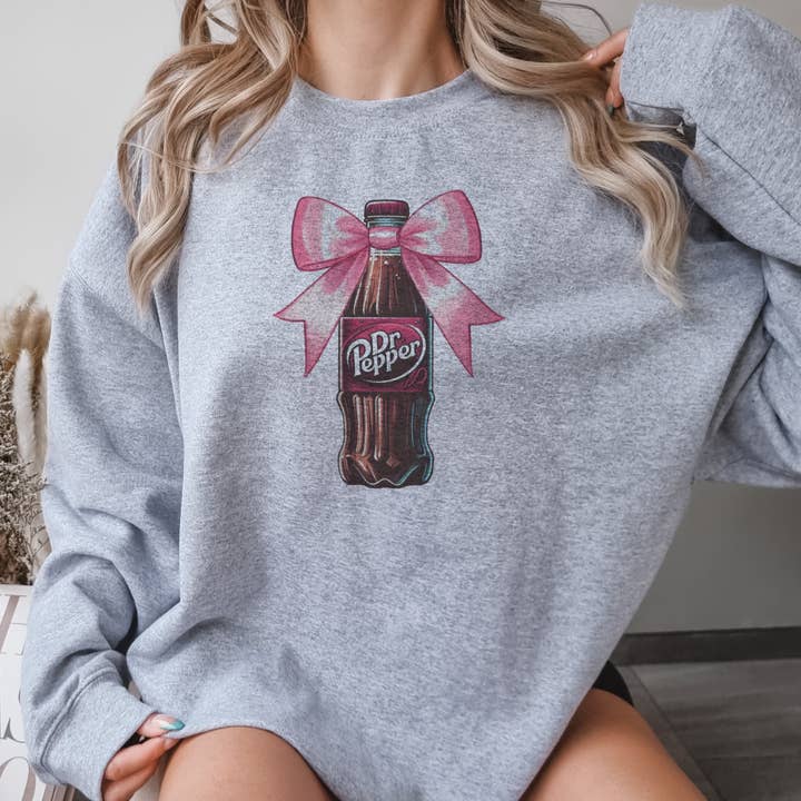 Par.tees by Party On! - Wholesale Graphic Sweatshirt - Women's - Coquette Dr. Pepper Pink Bow Soda Bottle Graphic Sweatshirt