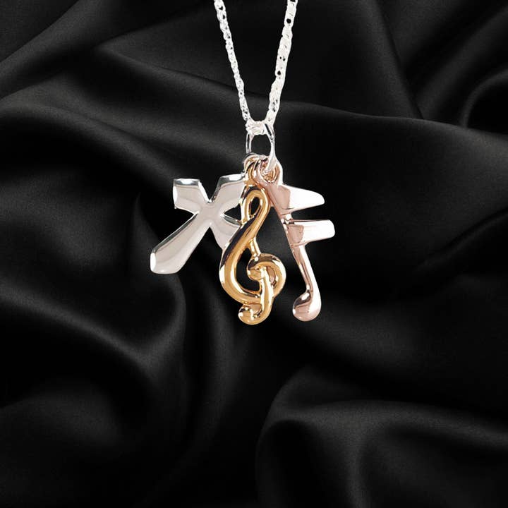 Dicksons - Vente Colliers à pendentif - Collier croix Tri Color, note de musique, clef de G1