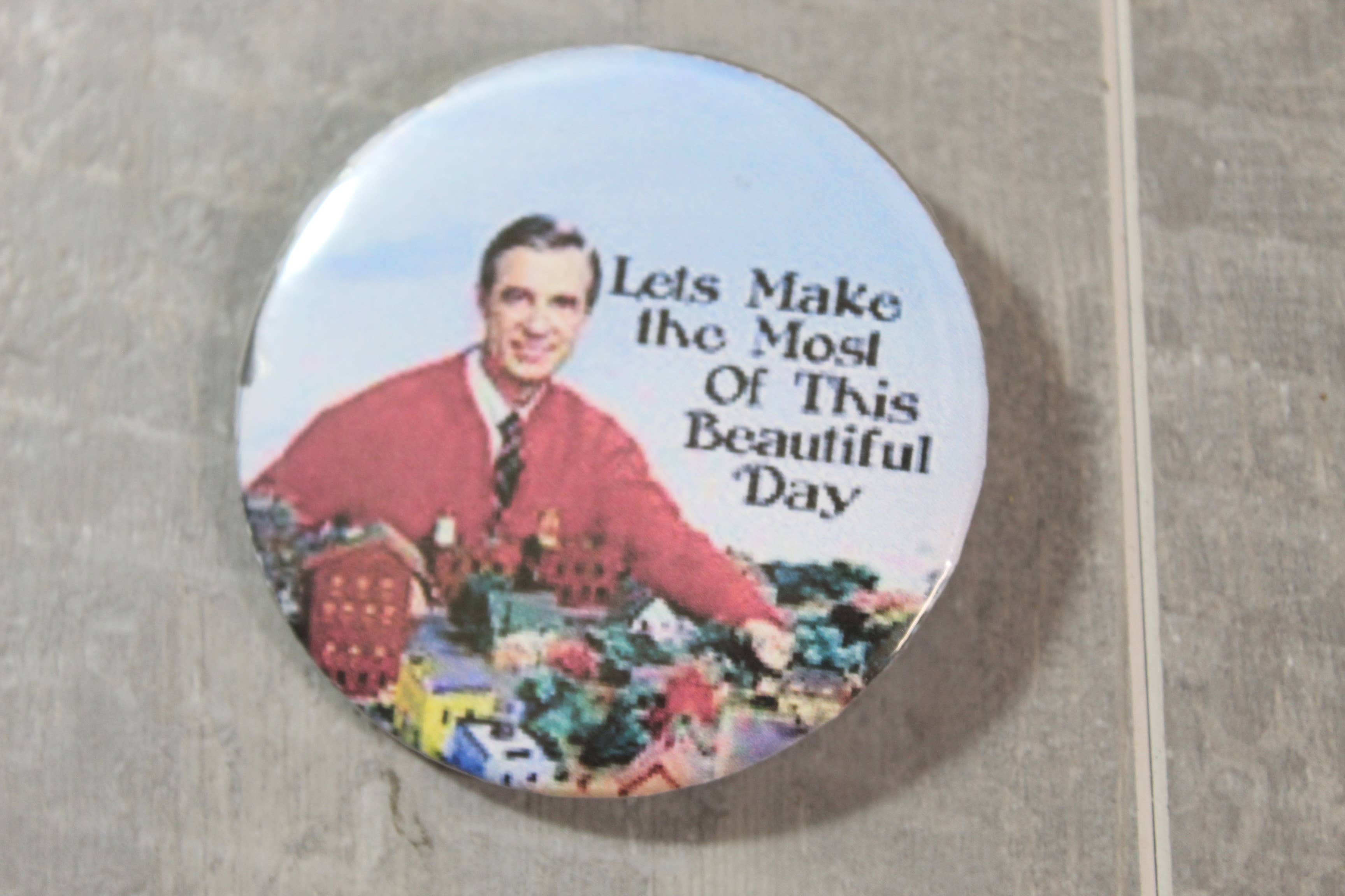 Raven Design - Wholesale Lapel Pin/Button - Mr. Rogers Let's Make the Most out of this day button0