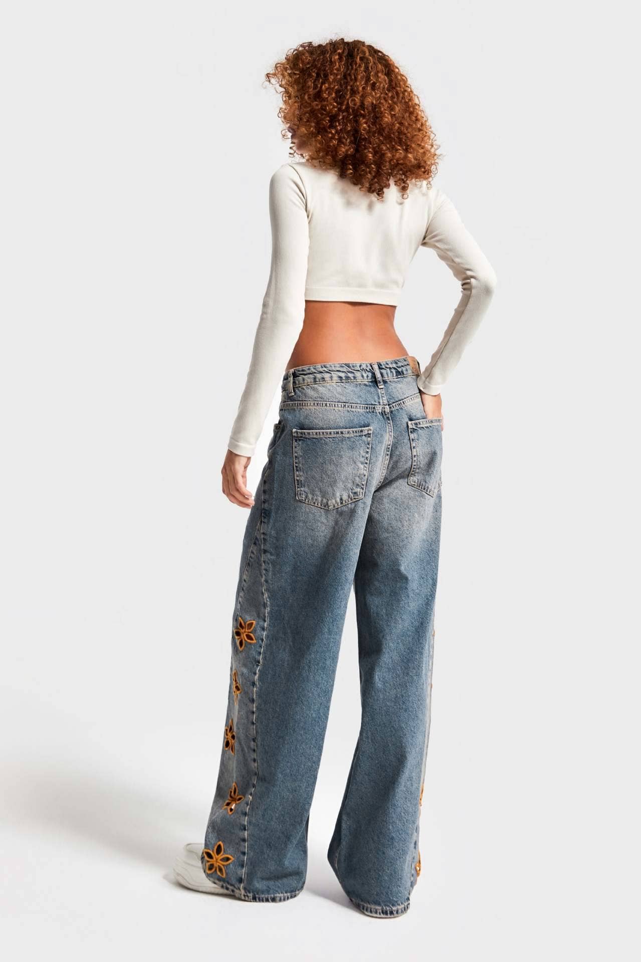Blue Floral cutout Embroidered Distressed jeans for wholesale on Faire6