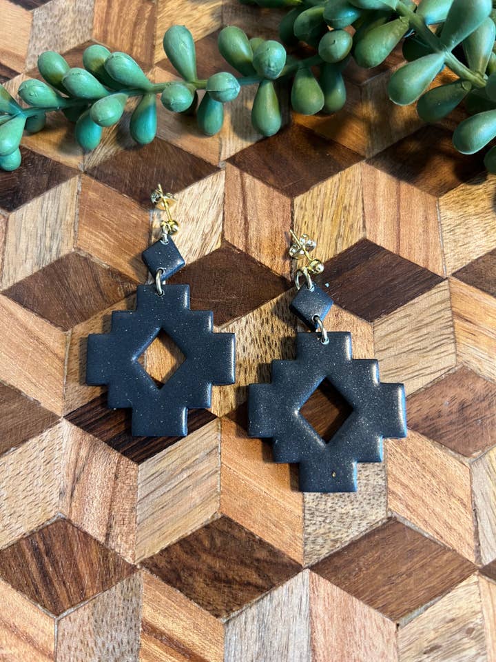 A cruz asteca oscila por atacado de Rae and Clay