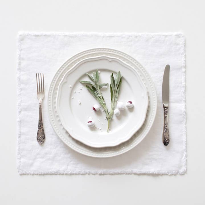 Optical White Linen Placemat with Fringes for wholesale by Linen Tales (We cover U.S. import duties)