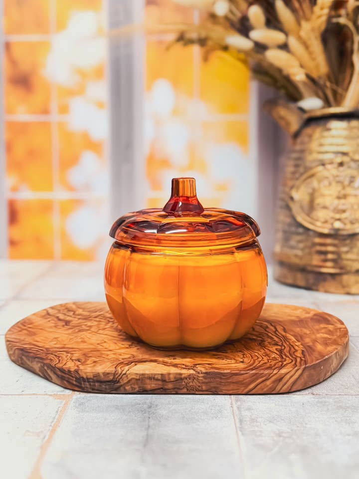 Orange Translucent Pumpkin Glass Jar Soy Candle (15oz.) for wholesale by Spirit Glow Home & Body Essentials