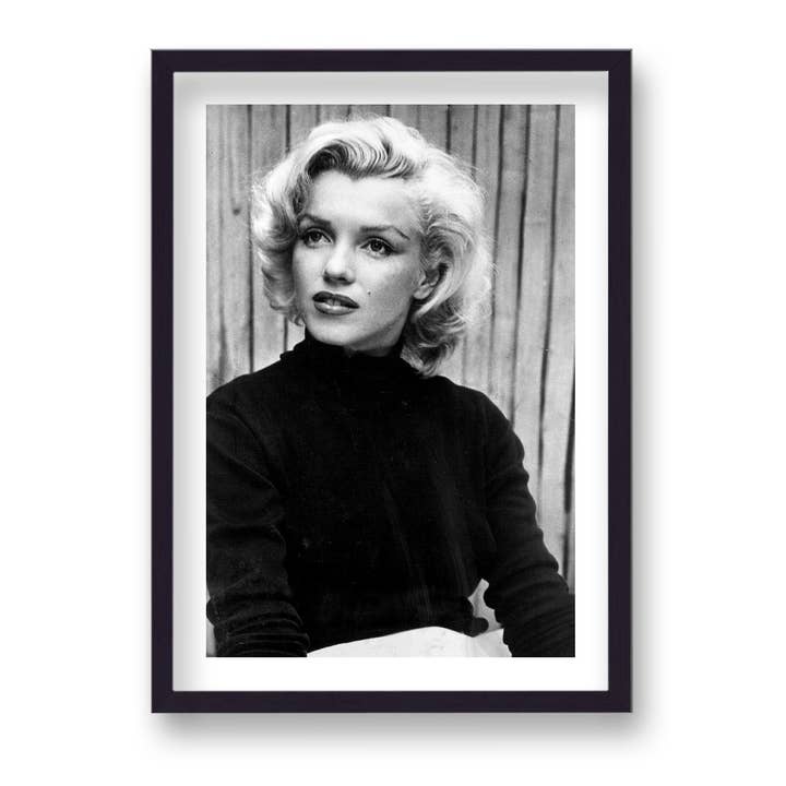 Marilyn Monroe Portrait Wearing Stylish Black Sweater Listening To Talk Out Of Picture Vintage Icon Print for wholesale by Gallery Print and Art