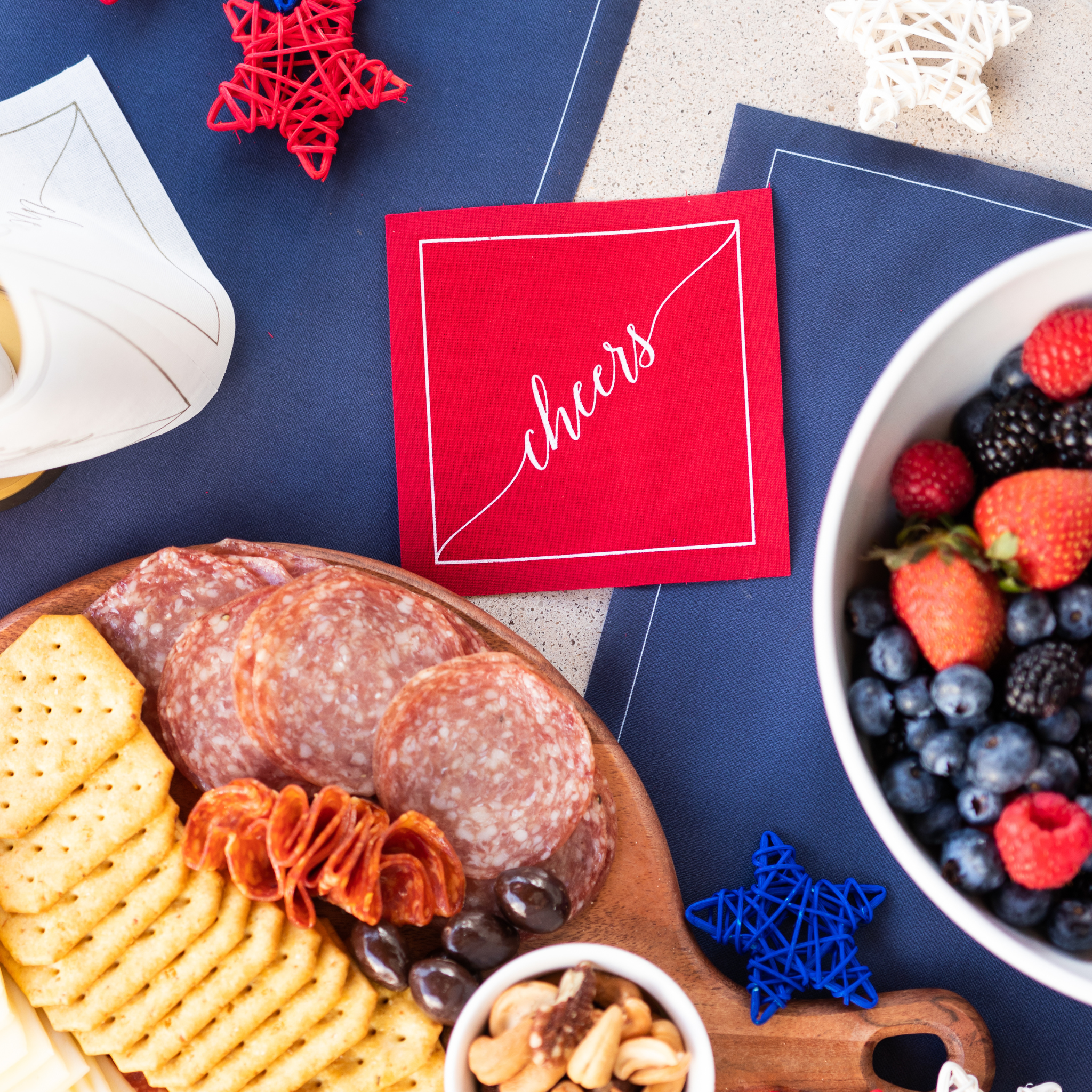 Table Theory (Formerly Toasting with Tara) - Wholesale Disposable Napkin - Cotton Cocktail Napkin Roll: The Red Carpet - White "Cheers"1