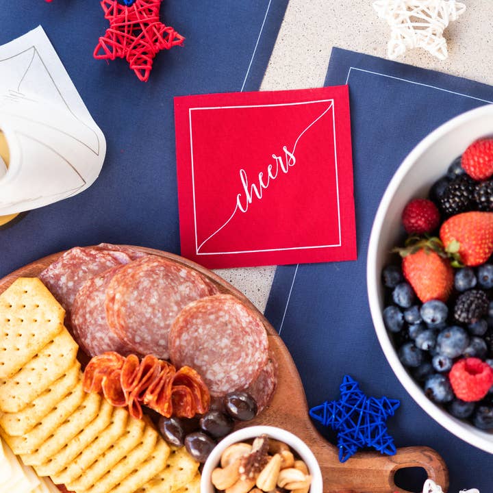 Table Theory (Formerly Toasting with Tara) - Wholesale Disposable Napkin - Cotton Cocktail Napkin Roll: The Red Carpet - White "Cheers"1