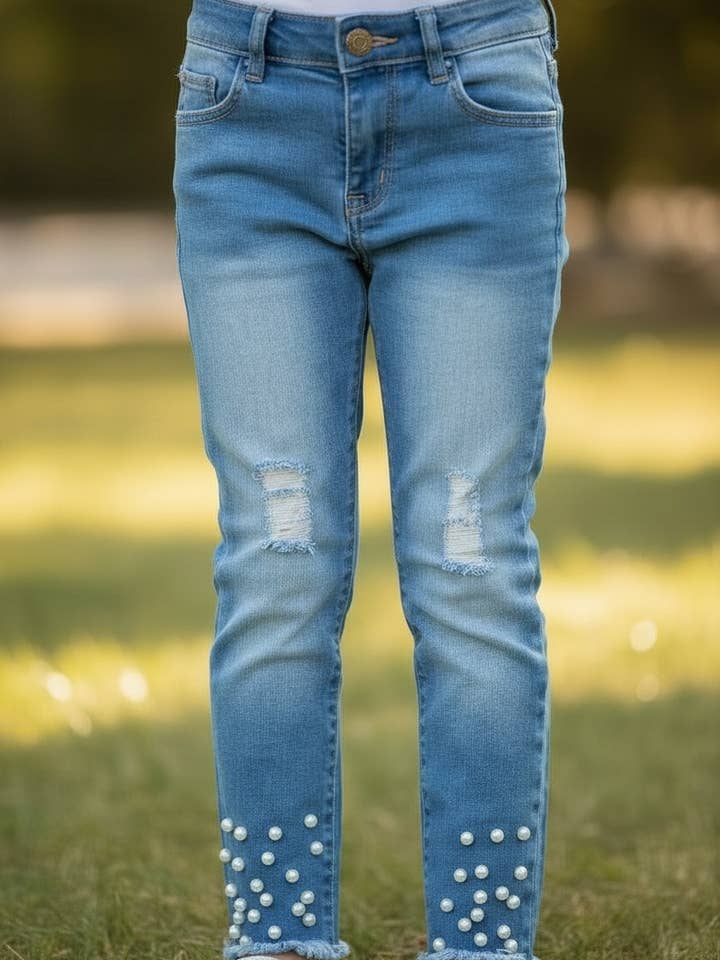Distressed skinny jeans with snapped pearls. PNG25113064 SOL for wholesale by Kids Charm Online
