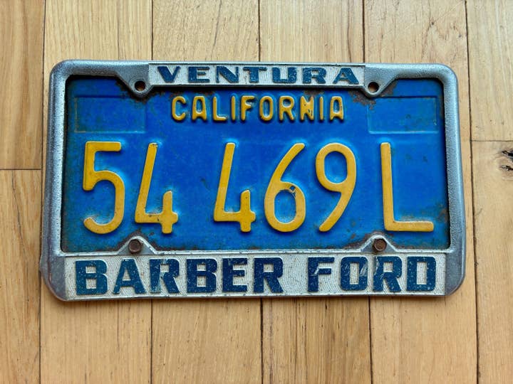1970s California License Plate with Ventura Barber Ford Frame Bolted on for wholesale by RusticPlates