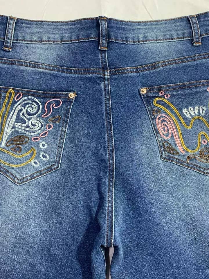 Blue Wild Western Floral Vine Embroidered flare jeans for wholesale on Faire6