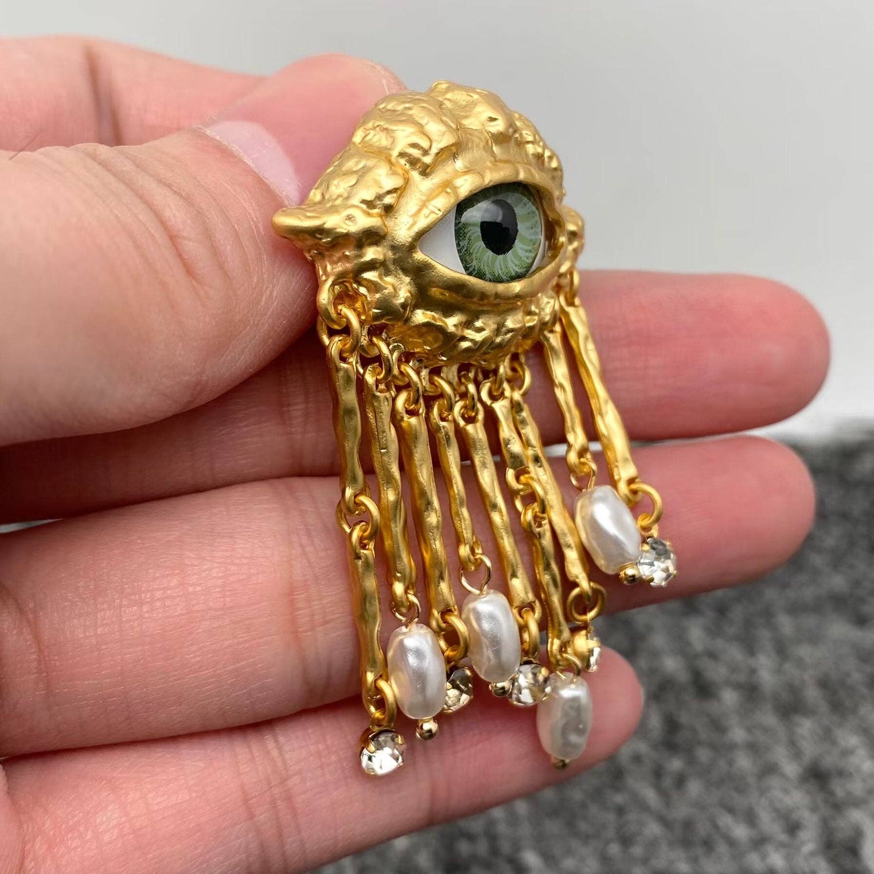 Mio Queena – wholesale Tofsörhängen – Turkey Evil Eye Pearl & CZ metall tofsstolpörhängen2