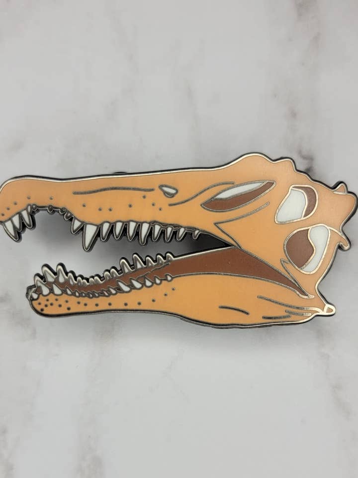 Spinosaurus Skull Enamel Pin for wholesale by Kingdom Animalia
