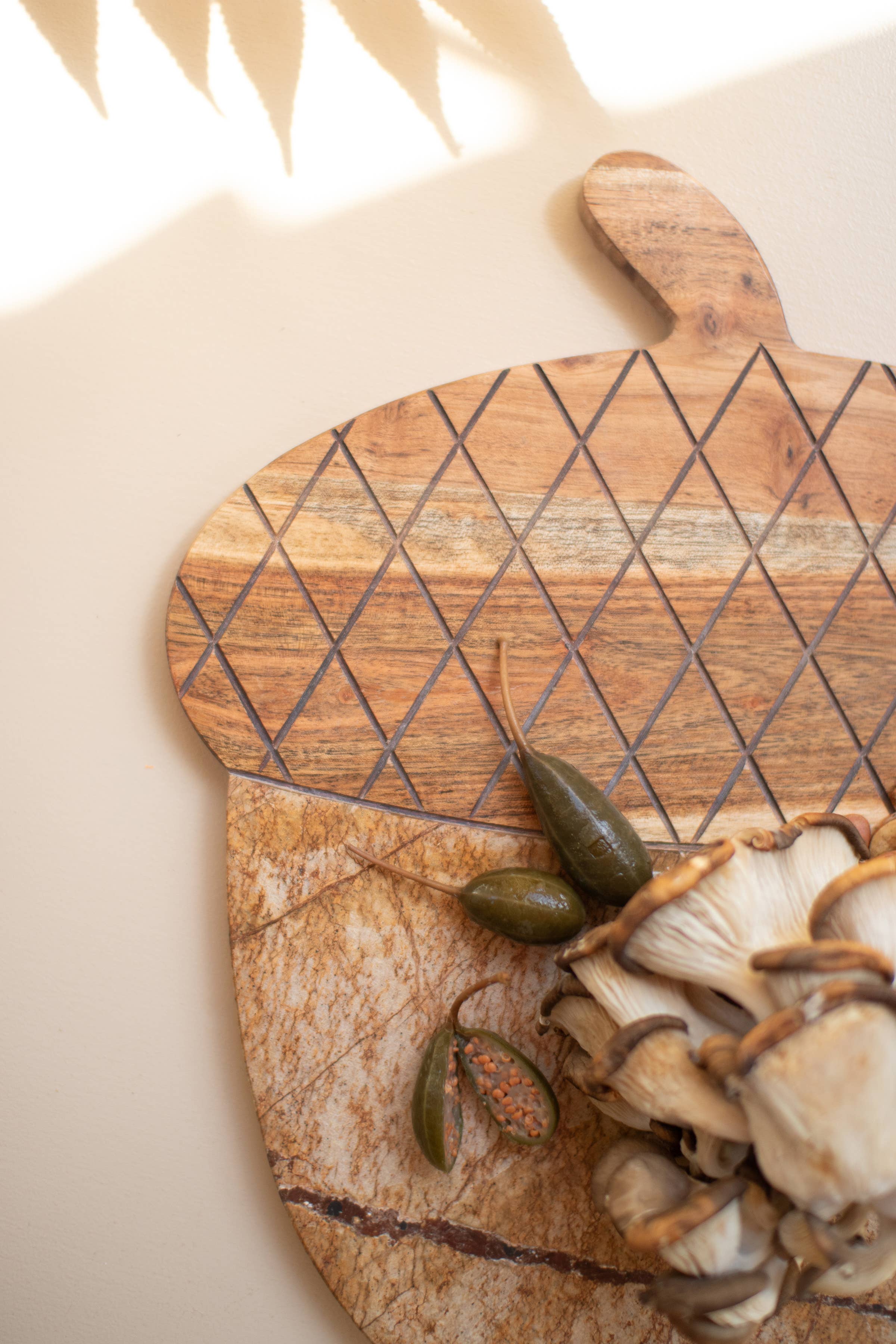 Brown ACACIA WOOD AND MARBLE ACORN SERVING BOARD for wholesale on Faire1