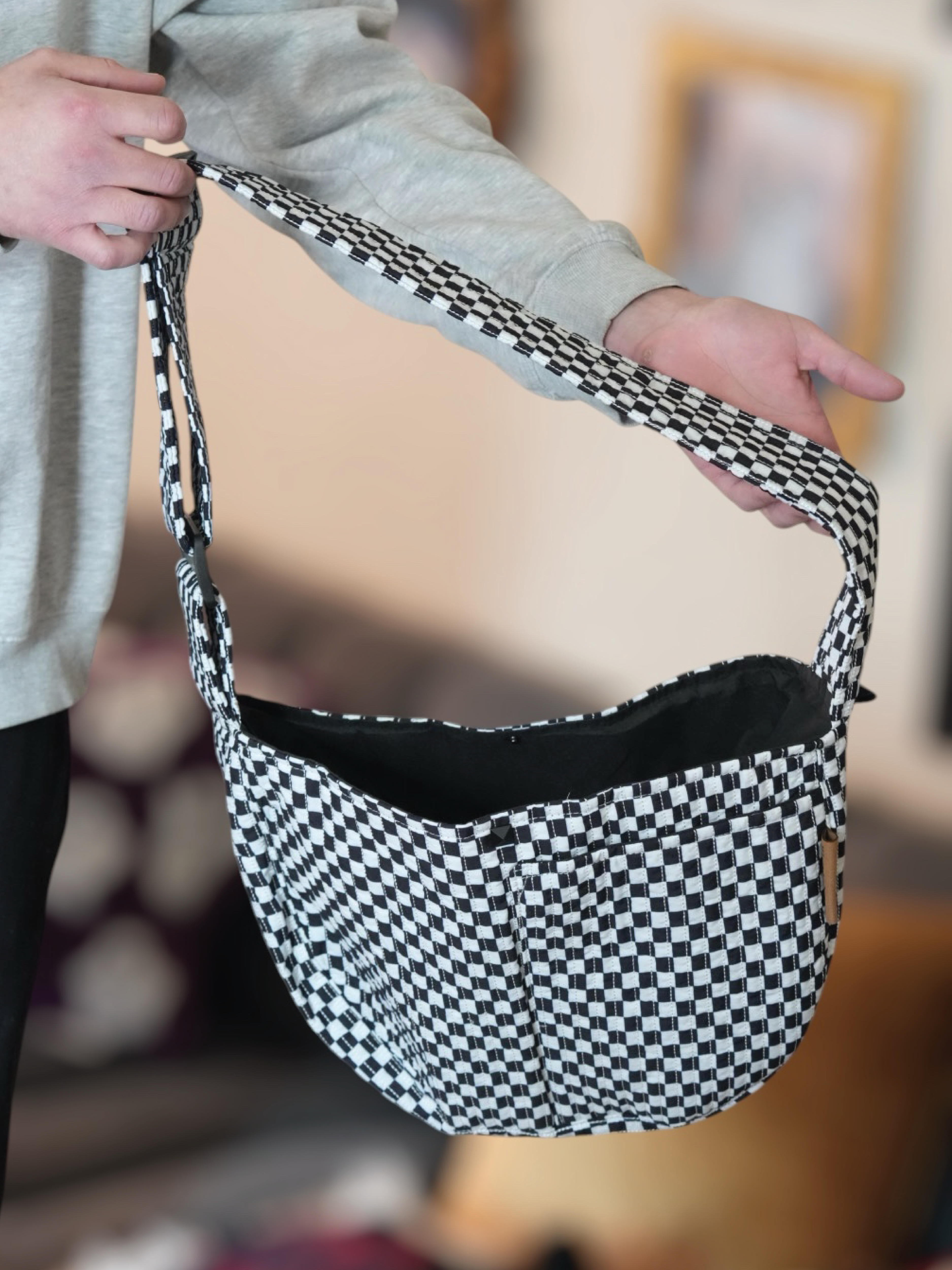 Black and White Pet Sling Carrier for wholesale on Faire3