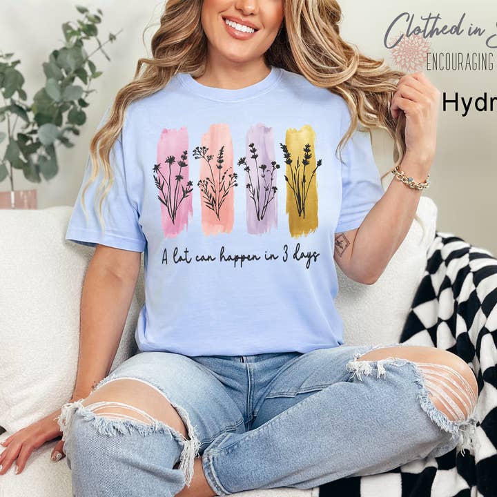 A Lot Can Happen in Three Days Easter Comfort Colors Tee for wholesale by Clothed in Strength