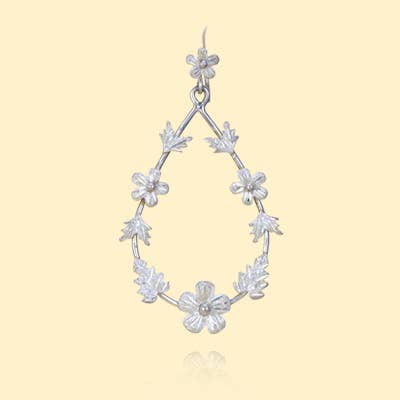 Oval Sterling Flower Earrings for wholesale by Moosepablos, Inc.