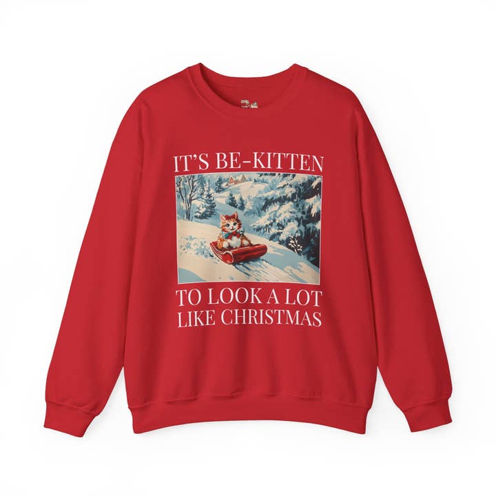 Funny Christmas Cat Lover Sweatshirt: Cute Kitten Sledding for wholesale by Opal and June