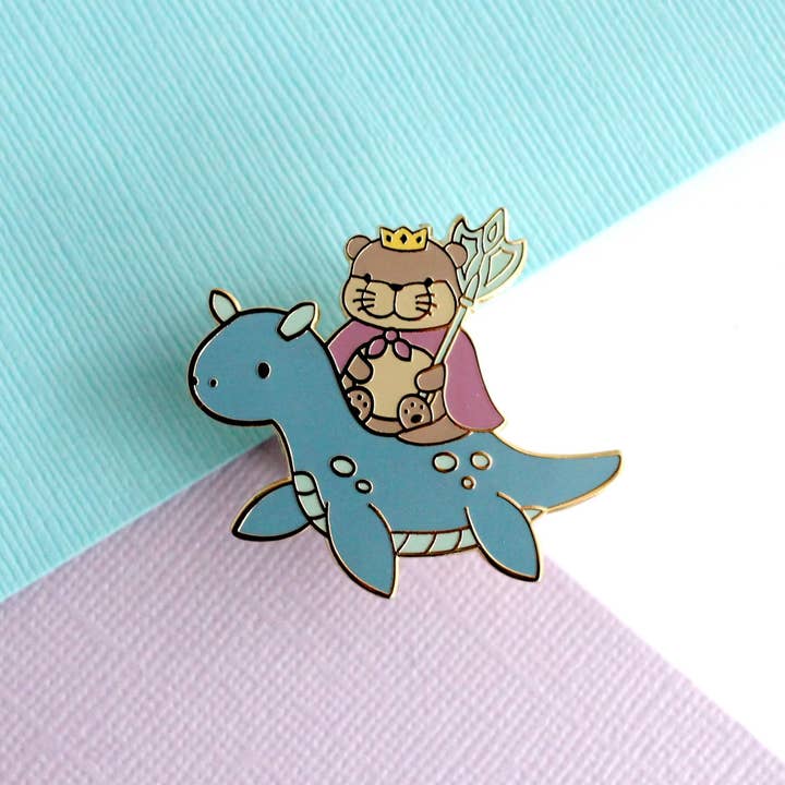 Otter King Riding Sea Dragon Enamel Pin (Dark Blue Dragon) for wholesale by Wild Whimsy Woolies