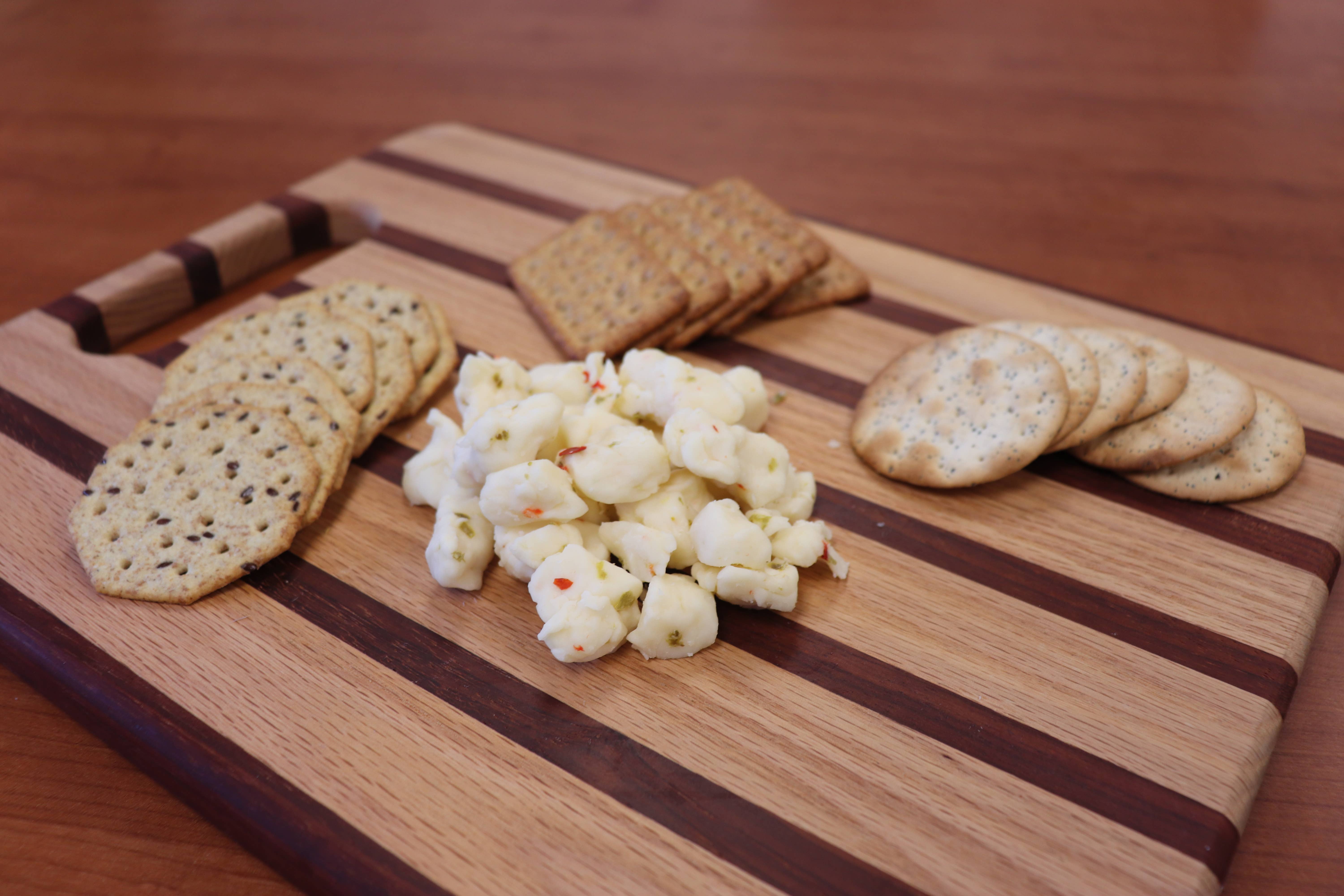 Alma Creamery LLC - Wholesale Cheese - 8oz. Pepper Cheddar Cheese Curds1