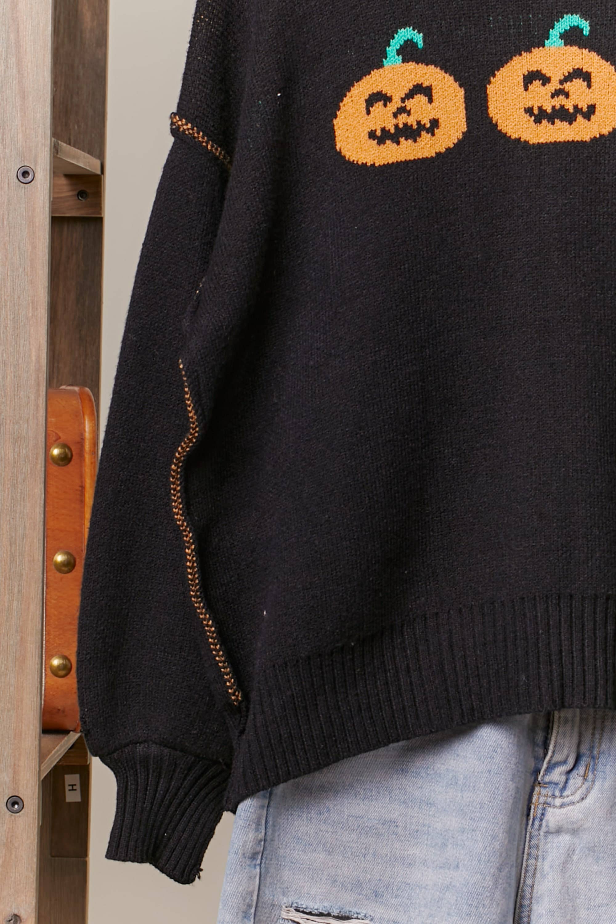 Black Hooded Halloween Sweater with Jaco O Embroidery for wholesale on Faire7