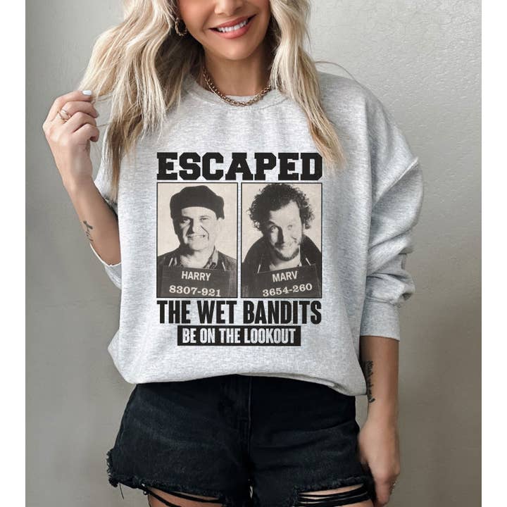 NVC Ecommerce LLC - Wholesale Graphic Sweatshirt - Women's - Retro Home Alone Escaped Mugshots The Wet Bandits Sweatshirt