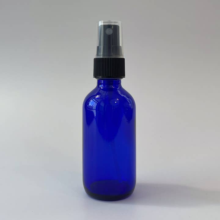 4oz Cobalt Blue Glass Bottle with Black Fine Mist Sprayer for wholesale by The Bottle Shoppe